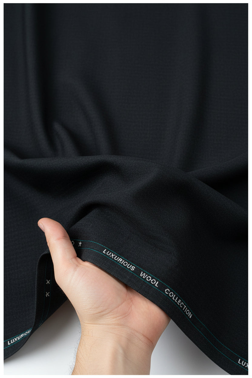 Grey Mafatlal poly wool trouser and suiting fabric shown in a close-up image of the woven textile.