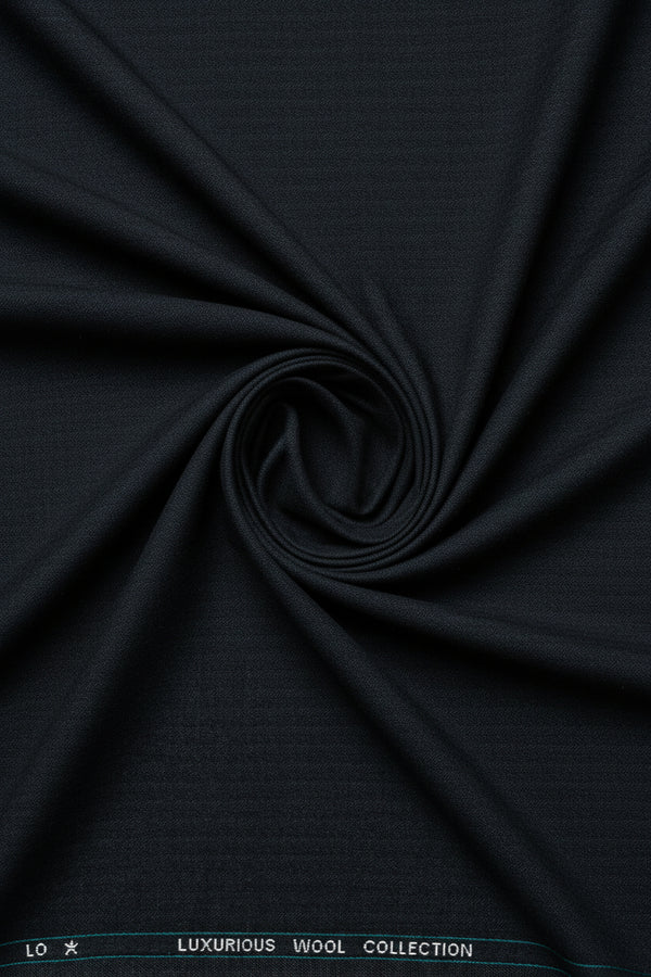 Grey Mafatlal poly wool suiting fabric close-up showing soft texture and woven pattern, ideal for tailored suits and formal wear.
