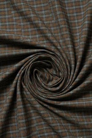Plaid fabric pattern with brown, blue, and white colors