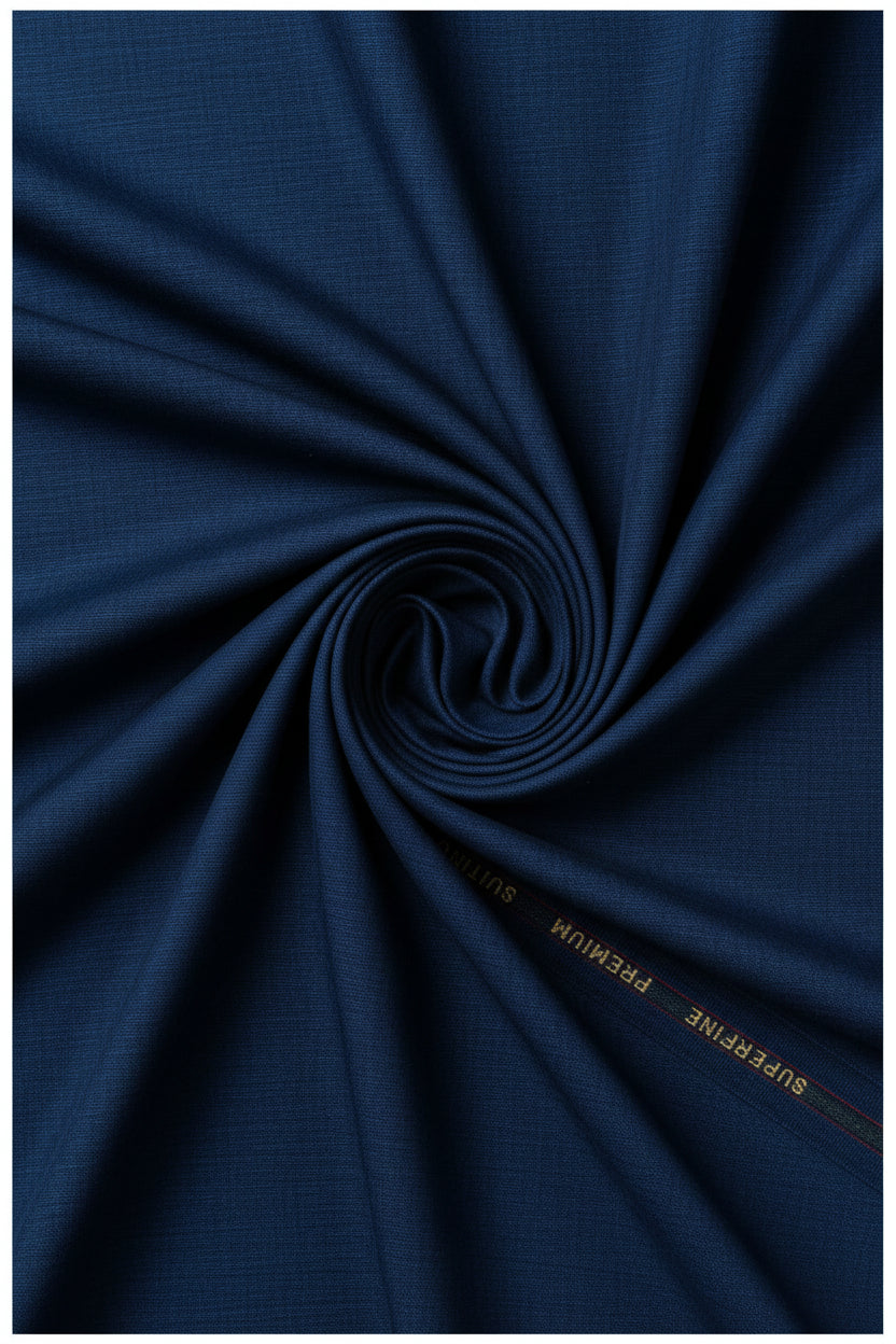 Royal blue Arvind poly viscose trousers and suiting fabric, showcasing the smooth, lightweight textile with a subtle sheen.
