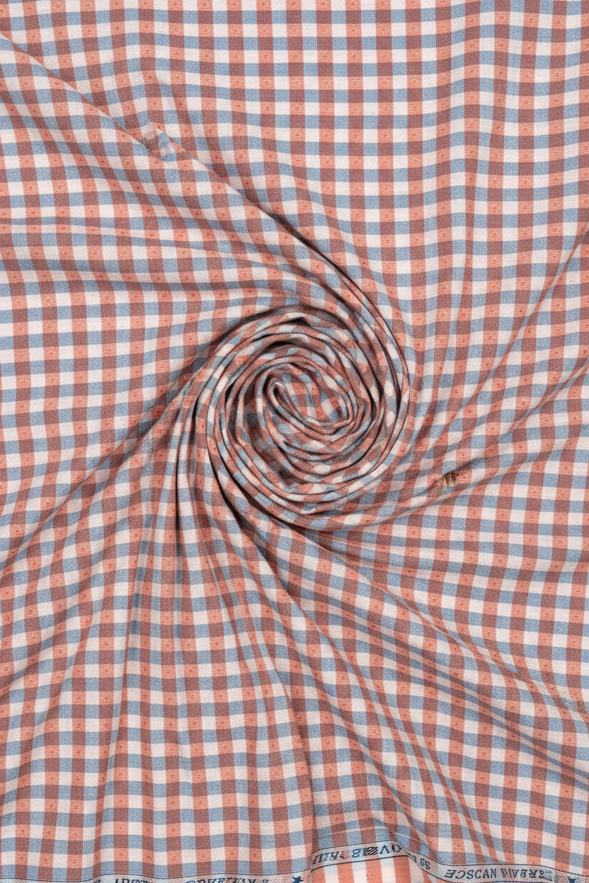 Checkered fabric with red and blue pattern, branded 'Tresca by Arvind Urban Solace Collection'.