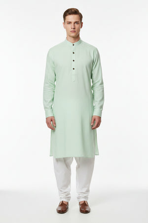 Green Arvind unstitched PC shirting fabric with a smooth texture and subtle pattern, ideal for making custom shirts.