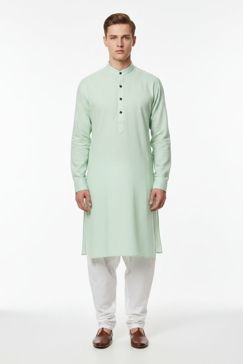 Green Arvind unstitched PC shirting fabric with a smooth texture and subtle pattern, ideal for making custom shirts.