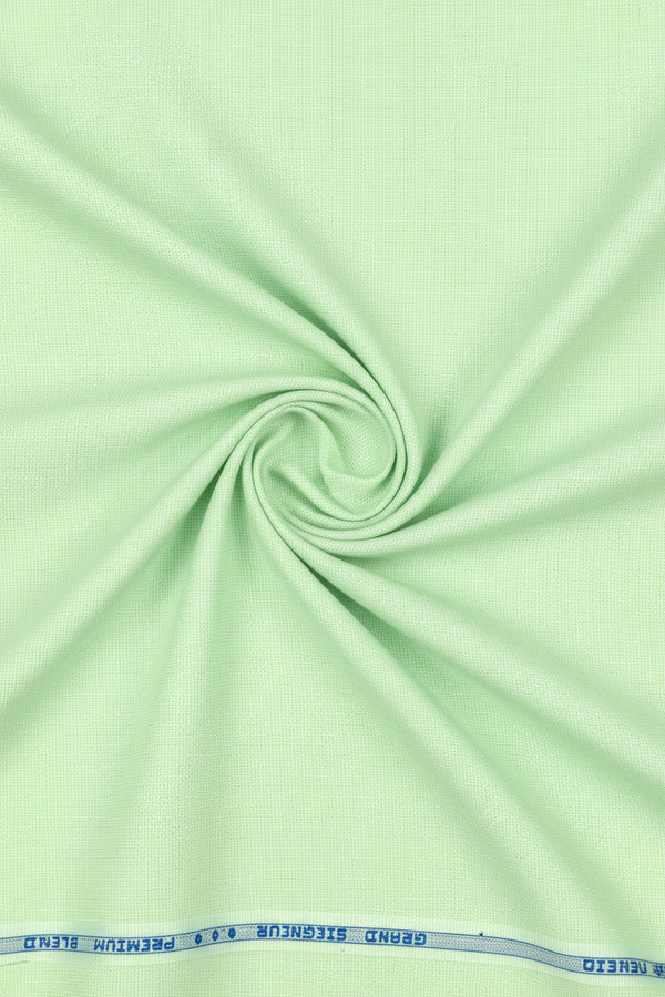 Green Arvind Giza shirt fabric made of polyester cotton, shown in close-up with textured weave and vibrant color.