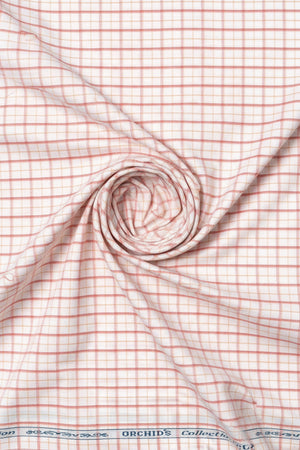 Carrot orange Arvind Checks cotton shirting fabric displaying a vibrant checkered pattern suitable for shirts.
