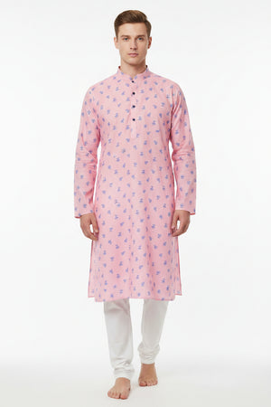 Pink Arvind cotton printed shirting fabric with intricate patterns, showcasing soft cotton texture and vibrant design.