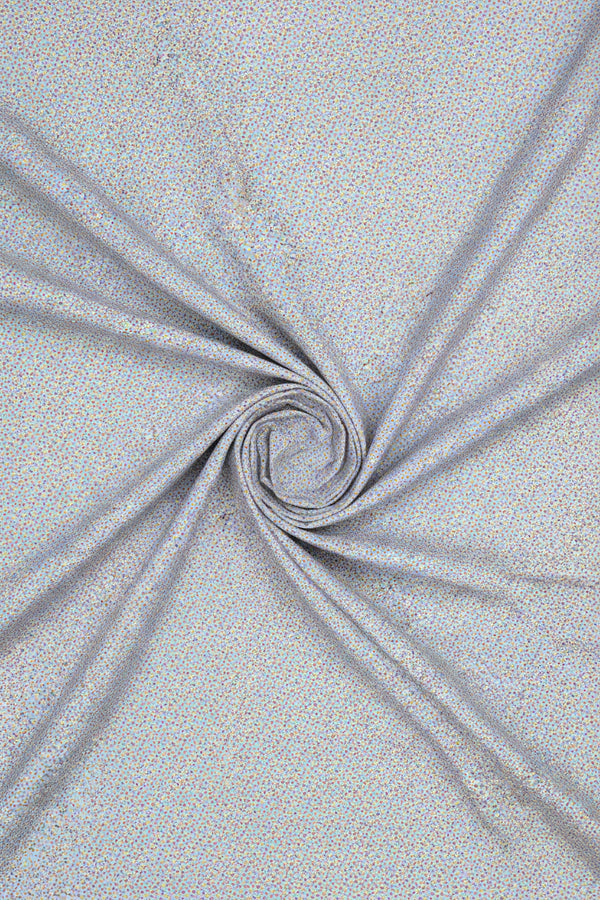 Textured fabric swatch with a blue and white pattern on a gray background