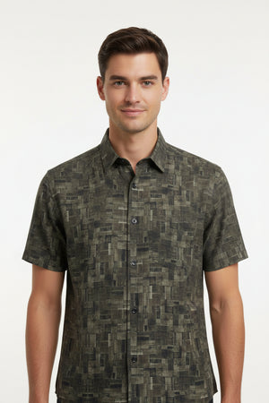 Olive green Pee Gee cotton shirt fabric with digital print pattern, close-up of the textured textile and vibrant design details.