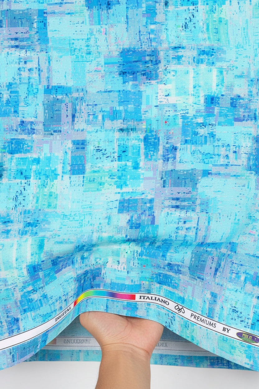 Blue digital print cotton shirting fabric by PEE GEE, showcasing intricate patterns and soft texture for stylish unstitched apparel.