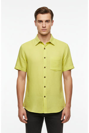 A close-up of a bright yellow-green linen fabric texture with a white header strip at the top containing blue printed text.
