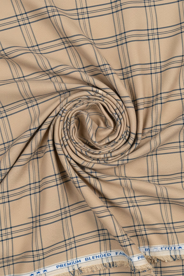 A close-up of beige fabric with a dark navy blue plaid pattern, showing the weave and a branded fabric border at the bottom.