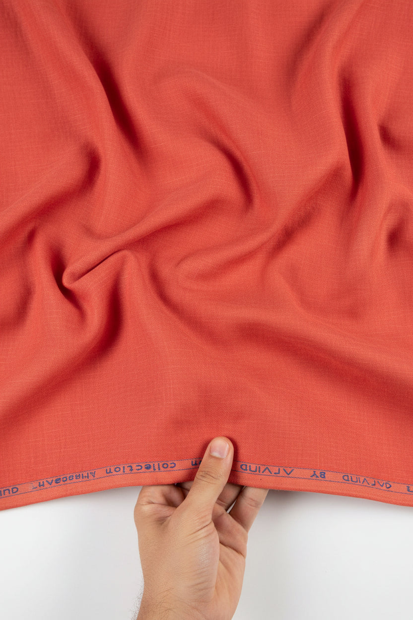 Red fabric with 'Premier Linen' label at the top