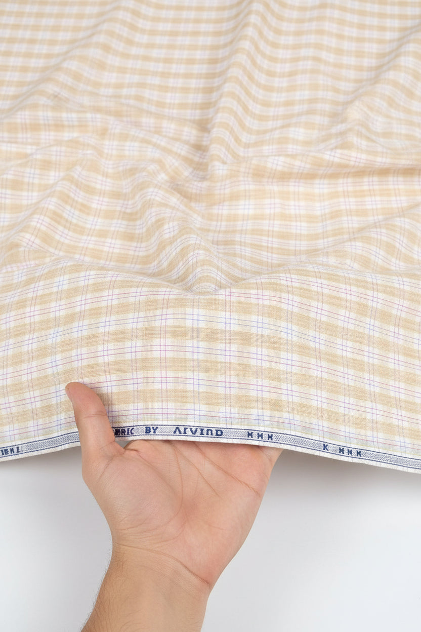Light orange Arvind cotton checks shirting fabric with a woven check pattern, suitable for creating stylish unstitched shirts.
