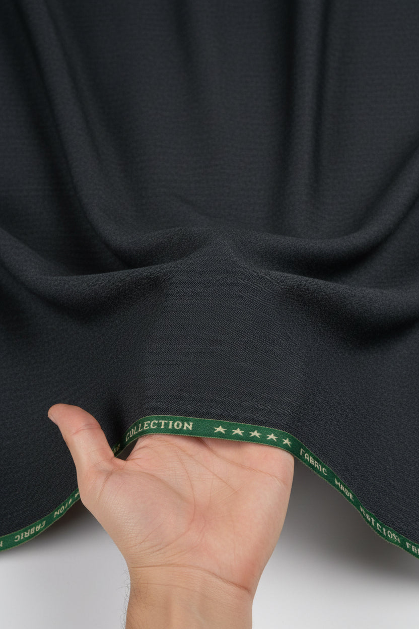 Raymond grey polywool trousers and suiting fabric, unstitched, with a smooth texture and tailored appearance.