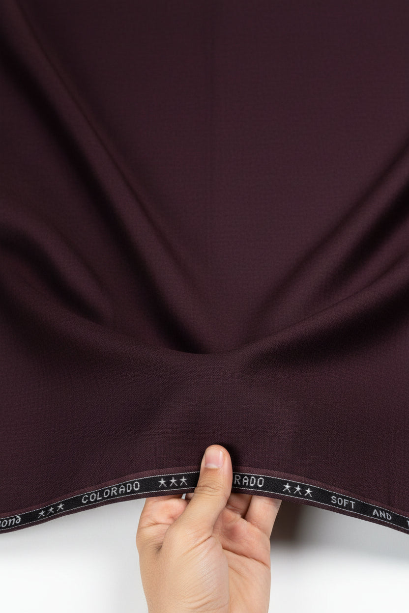 Dark purple fabric with 'Raymond Colorado' label at the top.