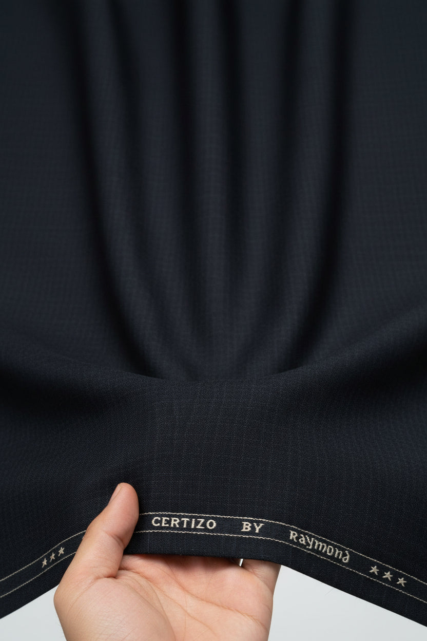 Black Raymond unstitched polyviscose fabric for trousers and suiting, shown in a close-up image of the fabric texture.