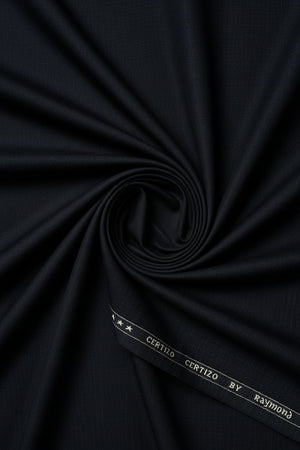 Black Raymond unstitched polyviscose trousers and suiting fabric shown laid flat, suitable for tailoring and formal wear.
