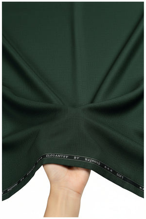Raymond green Polyviscose trousers and suiting fabric, close-up of smooth fabric with subtle texture and color detail.