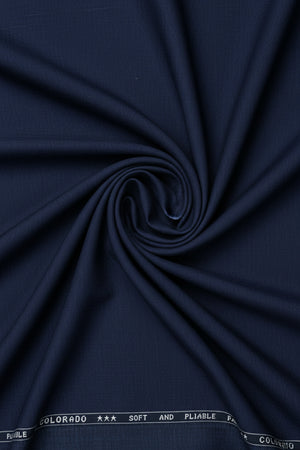 Navy blue Raymond Terry rayon trousers and suiting fabric, showing the smooth textile and fabric texture for tailored clothing.