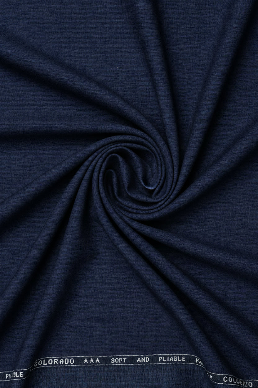 Navy blue Raymond Terry rayon trousers and suiting fabric, showing the smooth textile and fabric texture for tailored clothing.