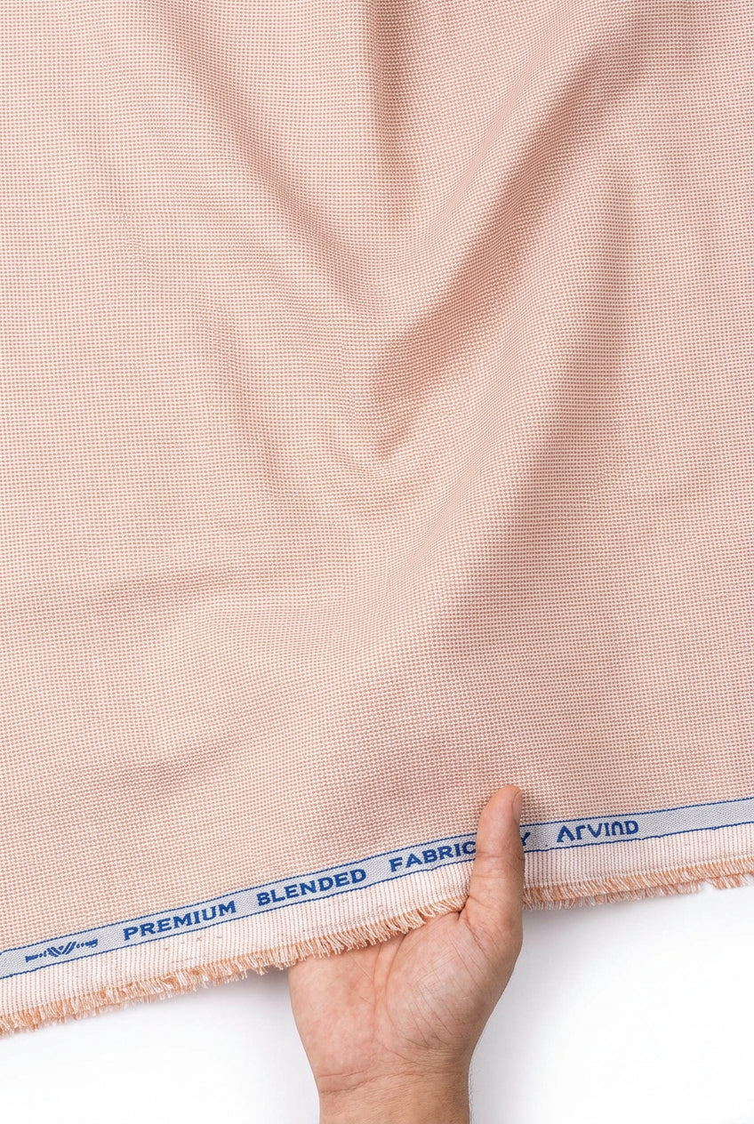 Peach Arvind Signature cotton polycot shirt fabric roll with textured weave, ideal for making stylish shirts and garments.