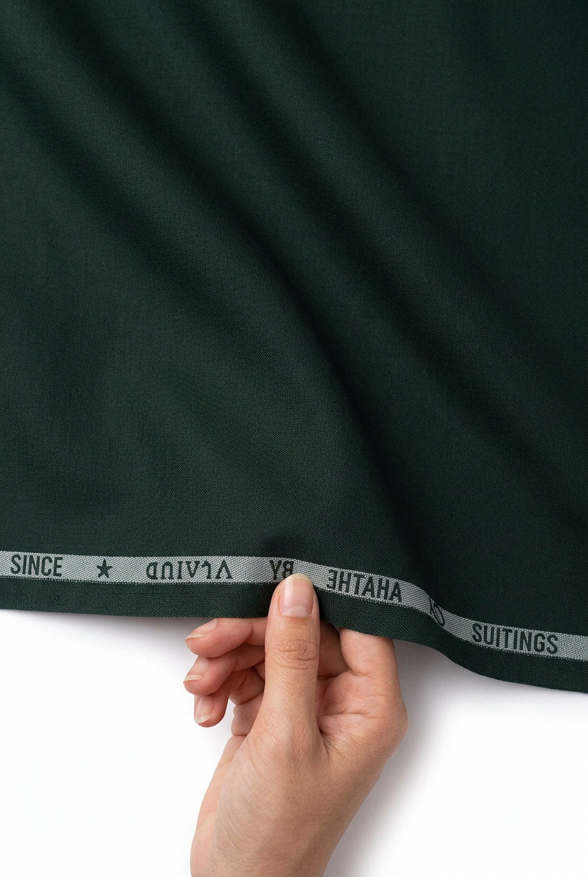 Dark green Arvind Terry Rayon Suiting Fabric with a smooth texture, ideal for stylish traditional and formal wear.