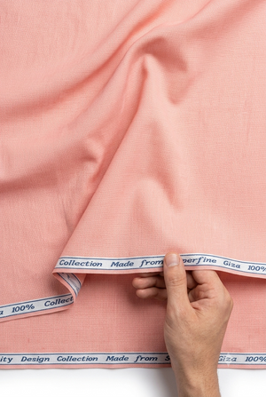 Light pink Arvind Giza cotton shirting fabric in misty rose color, showcasing soft, smooth textile with a subtle woven texture.