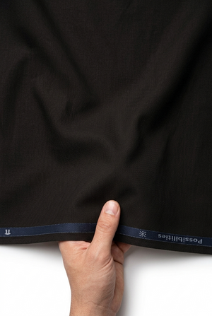 Brown Arvind Lycra stretchable trousers and suiting fabric, showcasing smooth fabric texture and tailored fit.