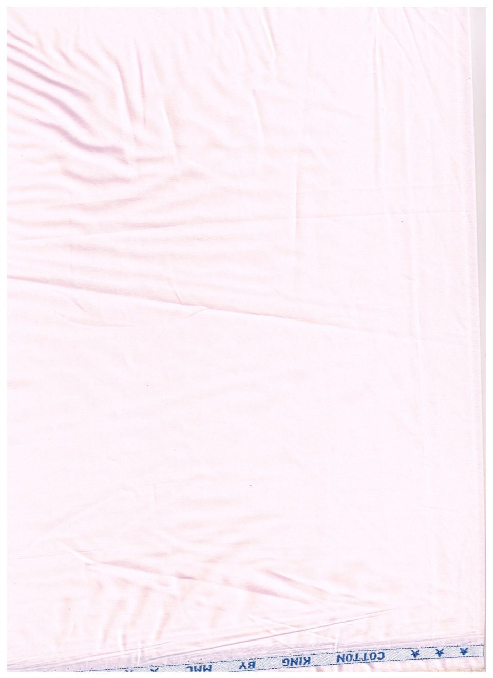 A light pink cotton fabric sheet with visible wrinkles, showing a blue printed edge with 'COTTON' text at the bottom.