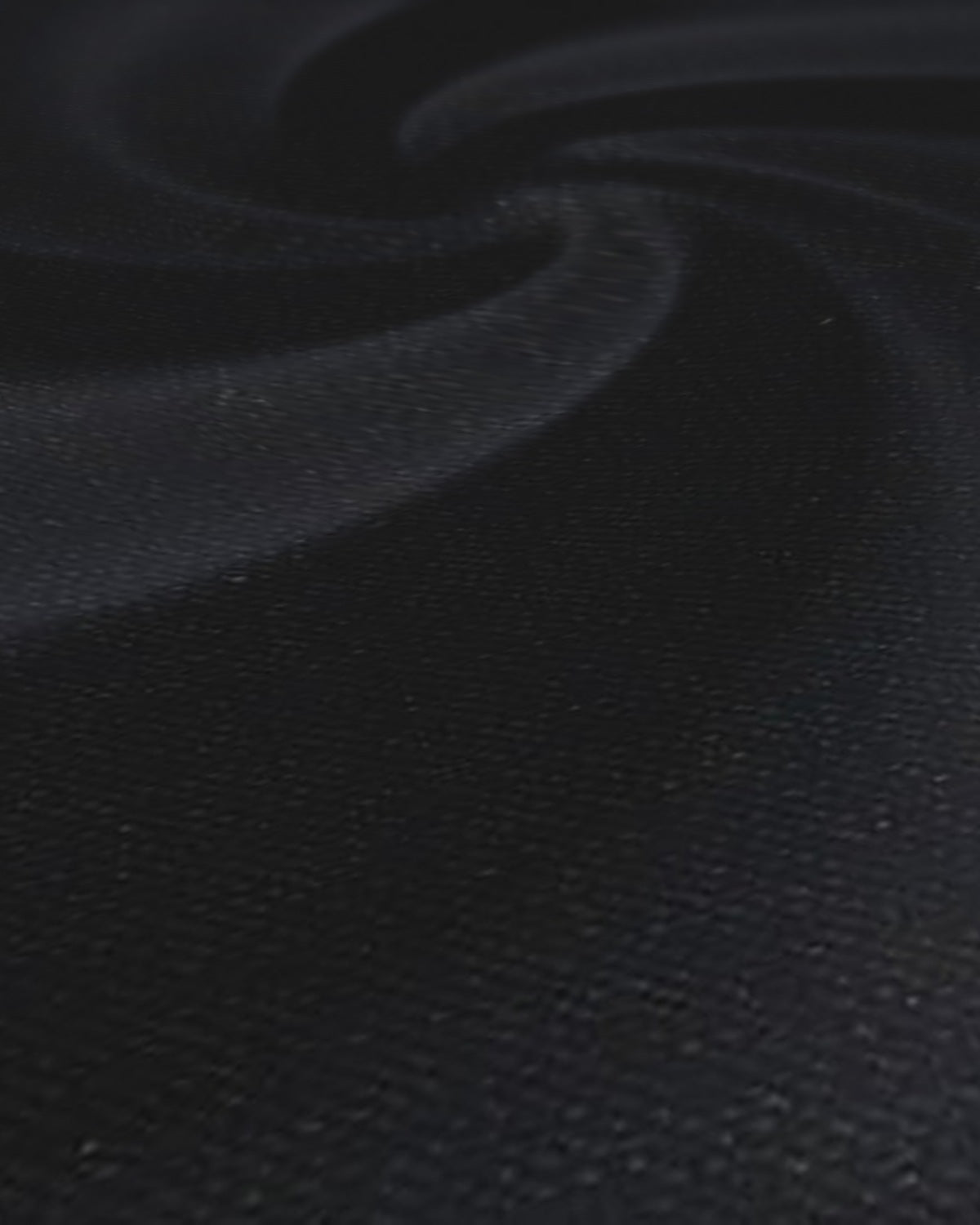 Arvind Terry Rayon Suiting Fabric Black - weave close-up with draped swirl